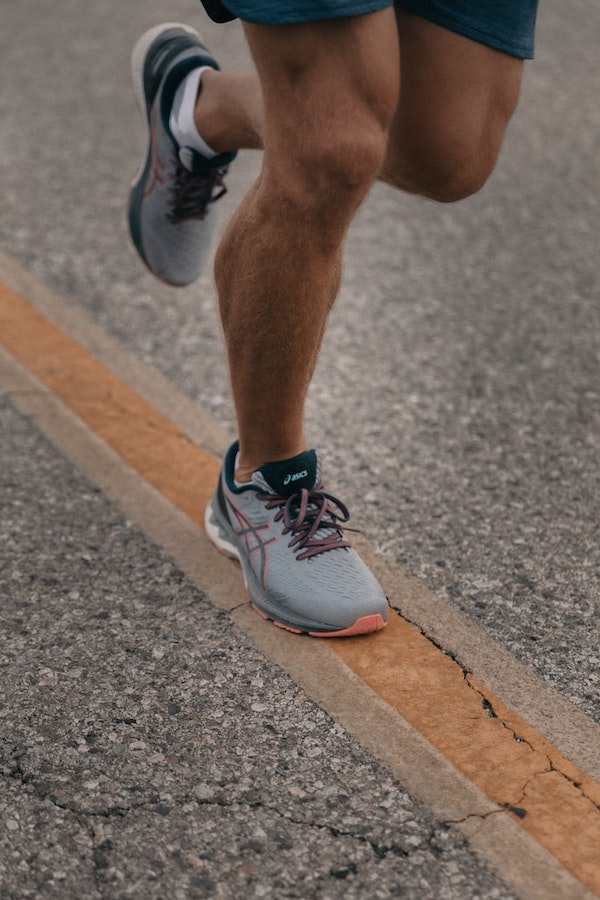 Picture of feet while running on pavement