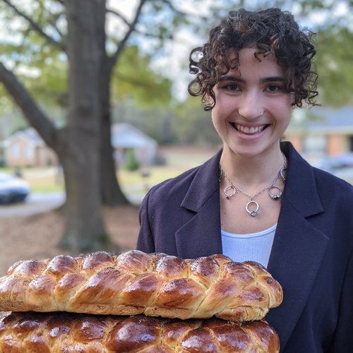 Maya holding bread